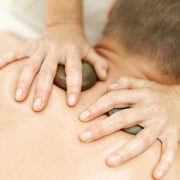 Massagem com Pedras Quentes